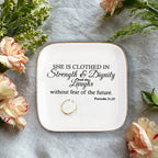 She is clothed in Strength Inspirational Gifts for Women Ceramic Ring Dish Birthday Gifts for Women Unique, Best Friends Gifts For Women Her Mom Sister Coworker